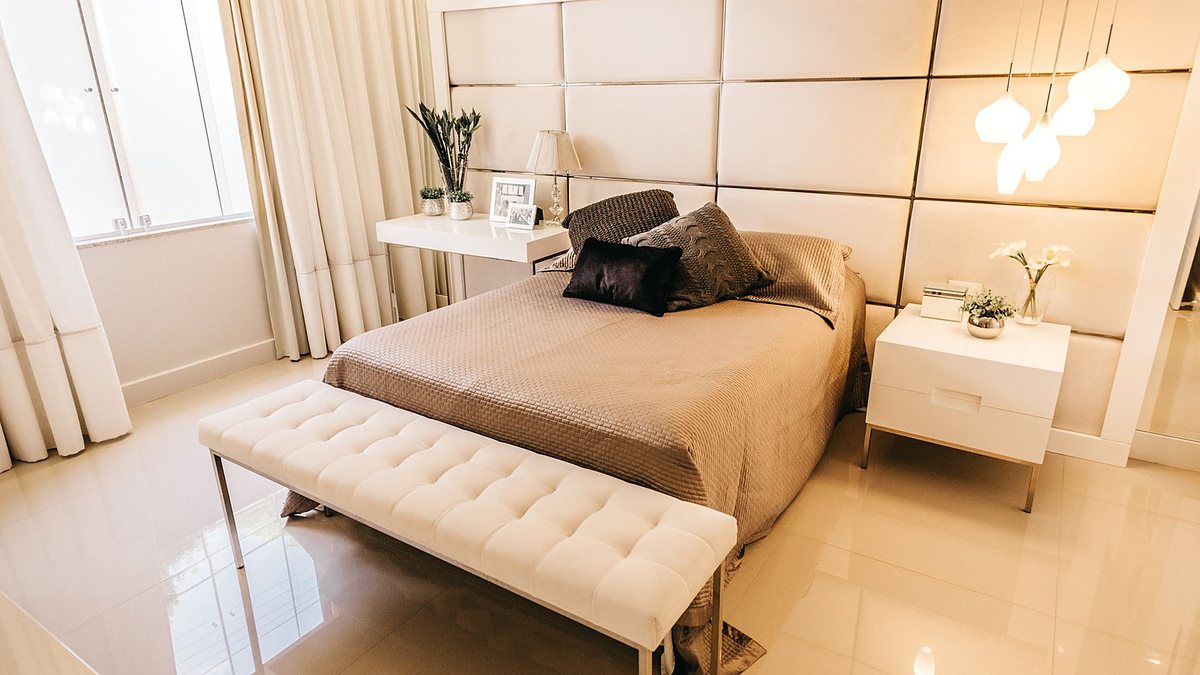 Modern bedroom with elegant design, soft lighting and cozy bedding