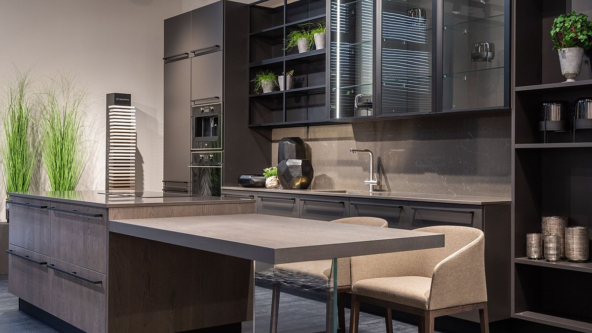 Modern kitchen with dark cabinets and counter in a spacious contemporary apartment